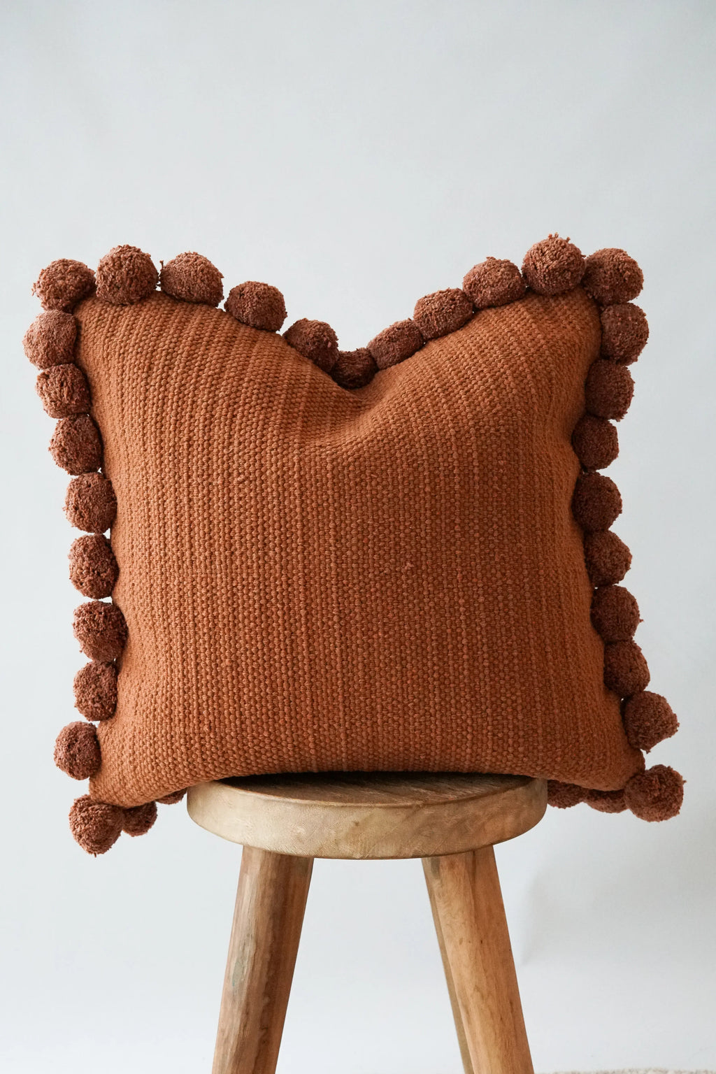 Luma Pom Pom Cushion in Clay