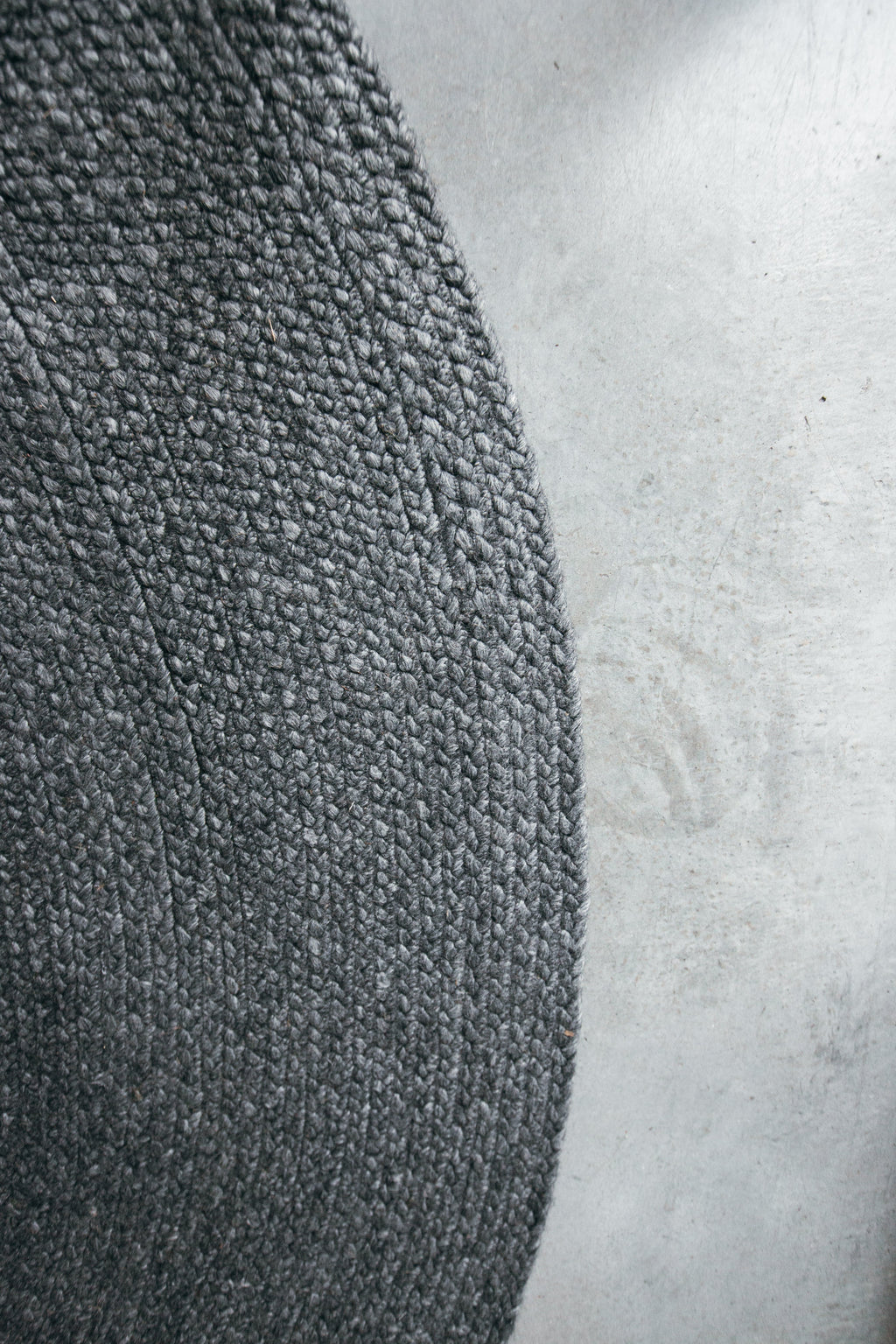 Jiva Round Braided Wool Rug in Charcoal